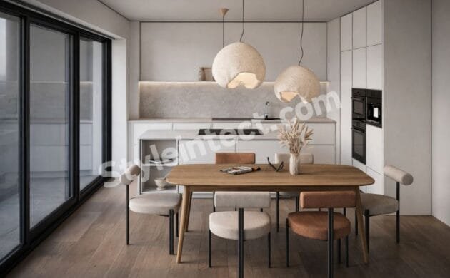 Modern Japandi kitchen design with straight modular kitchen layout, white handleless cabinets, kitchen island, built-in appliances, natural wood dining table, sculptural pendant lights, and a minimalist interior.